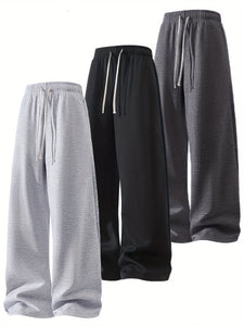 A Set of Three Solid Color Men'S Loose Straight-Leg Long Pants, Suitable for Spring And Autumn Fitness Activities - Made from Soft, Slightly Stretchy Knitted Fabric, Featuring a Drawstring Waist, Ideal for Outdoor Leisure And